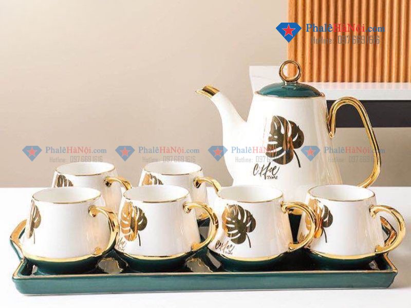 Các yếu tố ảnh hưởng đến giá bộ ấm chén in logo